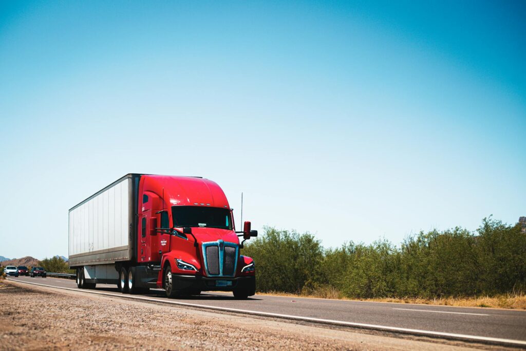 Kenworth T680 Semi-Trailer Truck Driving Down the Road